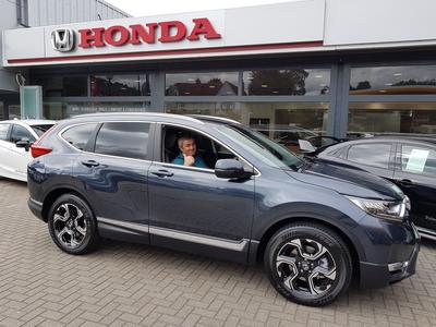 Mr Kobal gives a thumbs-up from the seat of his new Honda CR-V