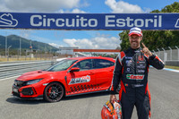 A triumphant Tiago Monteiro stands beside his winning Type R