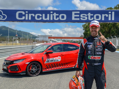 A victorious Tiago Monteiro stands beside his winning Type R